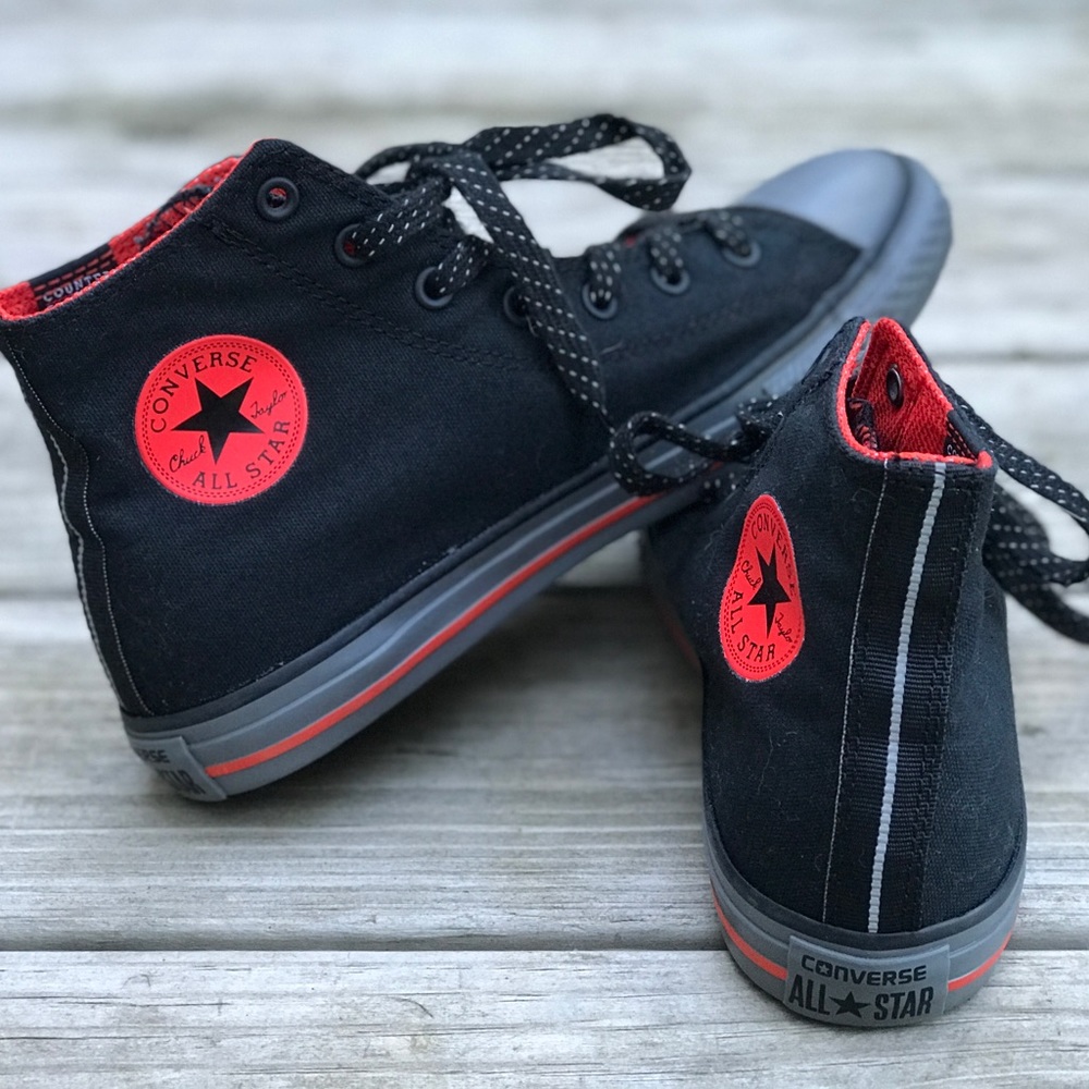Black Converse high tops.